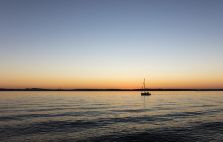 Sailing boat at summer eveningの写真素材