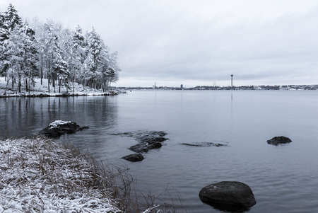 Next to lake at first snow timeの写真素材