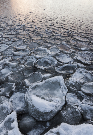 Lake freezing after frosty nightの写真素材