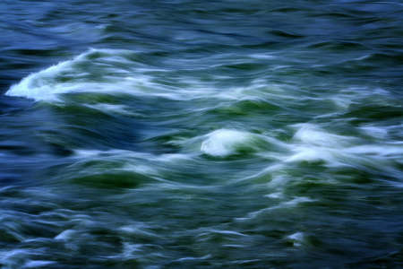 Beauty of blue and green flowing river waterの写真素材