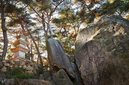 Buddhist Figures Carved On Rock Surface in Gyeongju.の写真素材