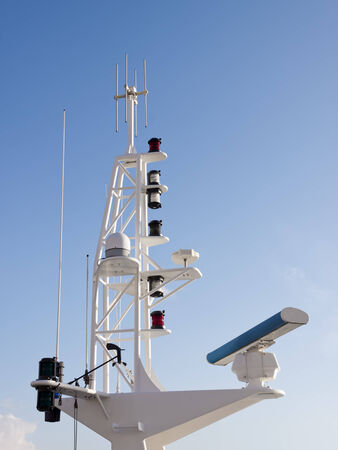 Antennas, radar, anemometer and other communication and navigation equipment on the mast of a ship の写真素材