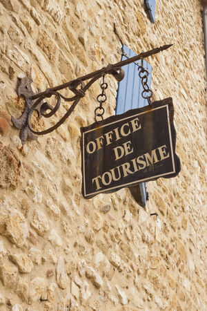 Office de Tourisme hanged sign in France, Europe.のeditorial素材