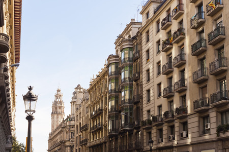 Via Laietana, a major thoroughfare in Barcelona, Catalonia, Spain in the Ciutat Vella district.Differents architectural styles buildings and the post building at background.のeditorial素材