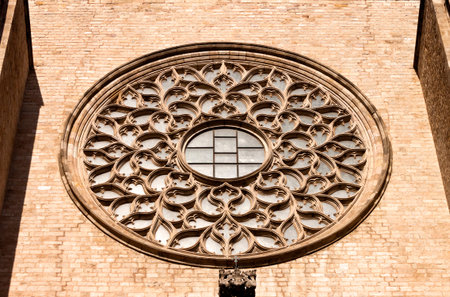 Rose window in the facade of the gothic cathedral of St Mary of the Sea in Barcelona, Catalonia,...