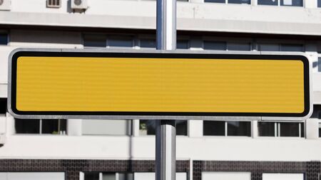 Blank yellow reflective road sign in the street. Empty traffic  signal for text.の写真素材