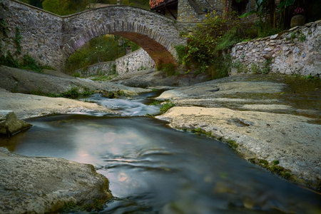 stone bridge with a river that crosses it