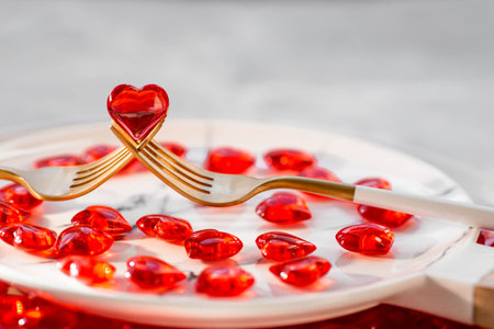 Banner. Heart on a fork close-up. Festive table setting. The concept of a holiday for cafes and restaurants. valentine's day. A copy of the space for the text.の写真素材