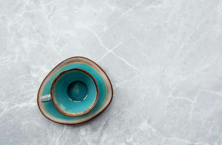 cafes and restaurants. A stylish coffee and tea mug is empty on a gray marble background. Place for the inscription. The concept of hot drinks.の写真素材