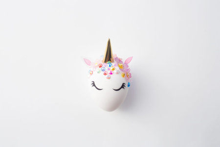 Banner. Easter eggs in the form of a unicorn, and with a gold pattern on a white background. flat...