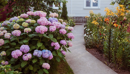 Summer photo or background with multicolored flowers. Beautiful nature scene with a flowering tree....