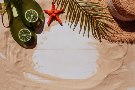 The concept of a holiday at the sea. Shells, a straw hat, sunglasses and the word summer on the...