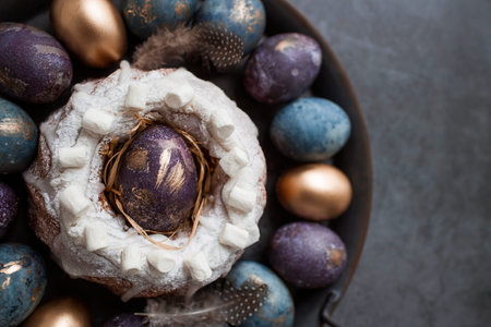 Easter card with a copy of the place for the text. Purple, blue and golden eggs with a cake on a...