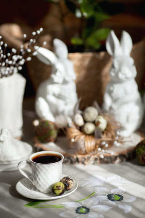 Dyed quail eggs and a beautiful white rabbits. Easter card with copy space for text. Moscow, April...