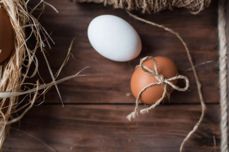 Easter eggs in the form of a rabbit in the hands of the girl. The concept of a happy bright Easter.の写真素材