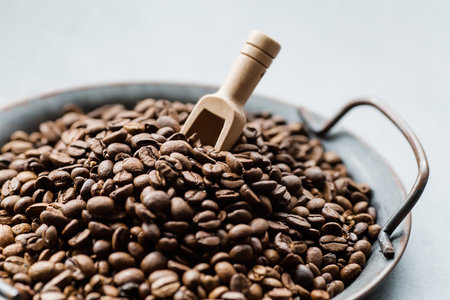 The menu of cafes and restaurants. Coffee beans and wooden spoon close-up. Copy space for text. The...