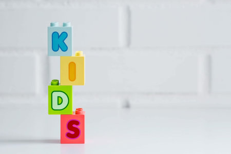 The word kids from the constructor on a white background. Children's educational logic toys are used...