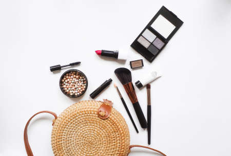 Makeup brush and decorative cosmetics on a white background with empty space. top view.の写真素材