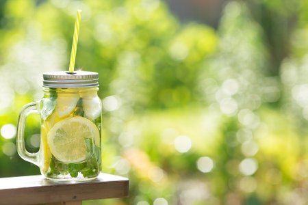 Mason jar of fresh lemonade outdoors, space for text. Space for textの写真素材