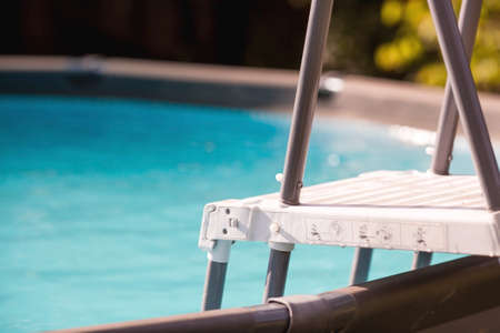 Swimming pool with metal frame for home and garden. Frame swimming pool in the yard. Solar banner.Installation of the pool. The concept of summer holidays and recreation.の写真素材
