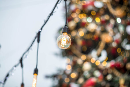 Christmas decoration of the streets. Beautiful landscape festives in the city. A garland of light bulbs. New Year's atmosphere. New Year and Christmas 2023.の写真素材