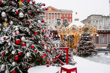 Christmas decoration of the streets. in classic red and green tones. Beautiful landscape festives in the city. Decorated Christmas trees.の写真素材