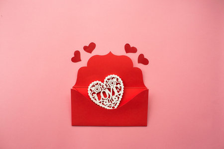 Red envelope and white hearts on pink background. love concept. Saint Valentine's Day concept....