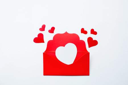 love letter. White heart-shaped card with red paper envelope on a white background. Layout for...