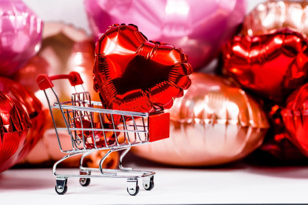 Food basket and balloons in the shape of a heart. online stores. Winter Holiday Sales, Seasonal Sales, Black Friday, February 14 Valentine's Day. Discounts and on-site purchases.の写真素材