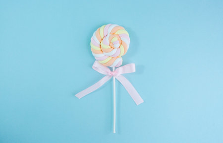 marshmallows. Chewy candy close-up on a turquoise background. Dessert of sweet food in a pink...