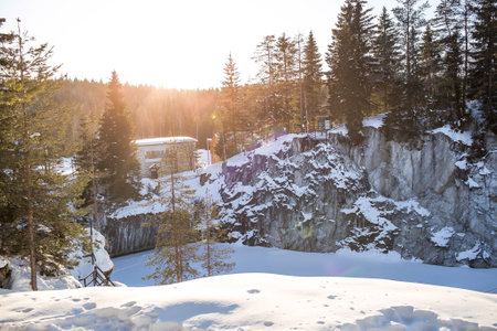 Winter landscape of Ruskeala Park. Marble canyon under the snow at sunset. Russia, Republic of Karelia.の写真素材