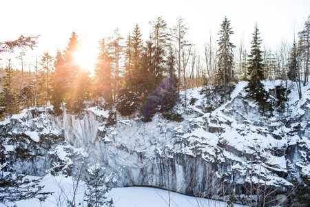 Winter landscape of Ruskeala Park. Marble canyon under the snow at sunset. Russia, Republic of Karelia.の写真素材