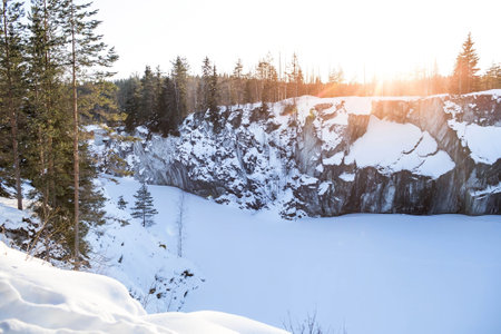 Winter landscape of Ruskeala Park. Marble canyon under the snow at sunset. Russia, Republic of Karelia.の写真素材