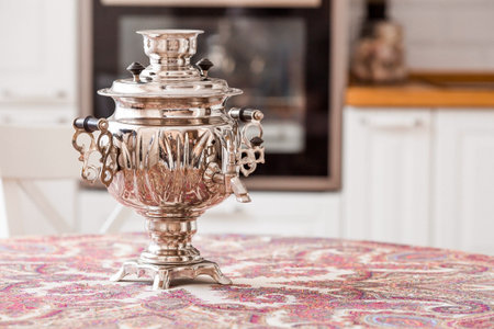 Russian traditions. Tea drinking with a samovar. Still life with Russian samovars in the interior of a modern white kitchen.の写真素材