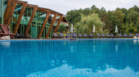 An outdoor swimming pool with sun loungers on the decks next to the spa center. A place to relax in a resort hotel. Tourism of the Moscow region. Russia, the city of Tarusa, Welna Spa Hotel, 2021のeditorial素材