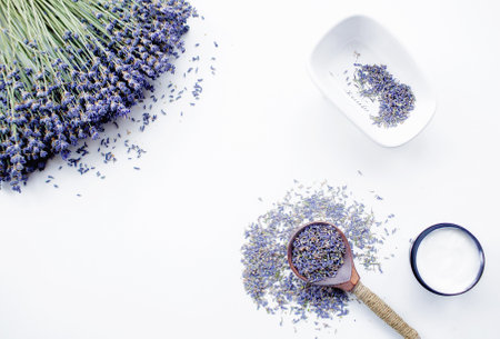 natural grass. Cosmetics with lavender on a white background, top view. Space for an inscription. beauty and health concept.の写真素材