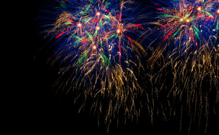 Bright colorful fireworks on the background of the black night sky. Salute celebration. Bright...