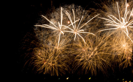 Bright colorful fireworks on the background of the black night sky. Salute celebration. Bright lights.の写真素材