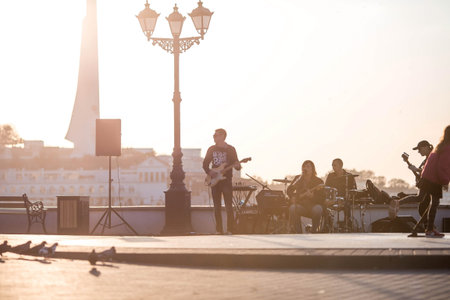 The embankment in Sevastopol in the rays of the setting sun. People are walking around the city. Russia, Republic of Crimea.のeditorial素材