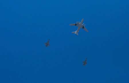 Rehearsal of the Victory Day parade. A group of military aircraft on a blue sky background. Moscow....