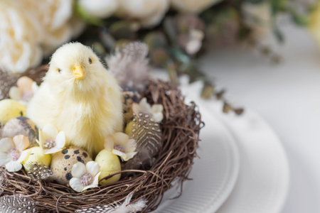 Banner. The concept of a bright Easter holiday. A bouquet of flowers with feathers, yellow chickens...