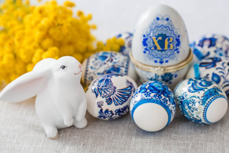 A large egg box with the inscription XB, mimosa, Easter bunny and Easter eggs in traditional Russian...