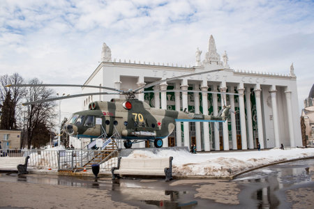 Soviet Mi-8 helicopter on the background of the pavilion "Transport" and "Cosmos" of the All-Russian Exhibition Center VDNH. Moscow, Russia.のeditorial素材