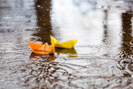 It's springtime. paper boats on the water. Photo of spring and autumn holidays. The concept of spring.の写真素材