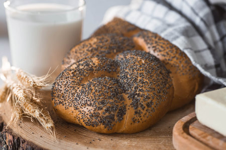 Classic wheat braid with poppy seeds. Delicious bread close-up. Freshly baked sourdough bread with a...