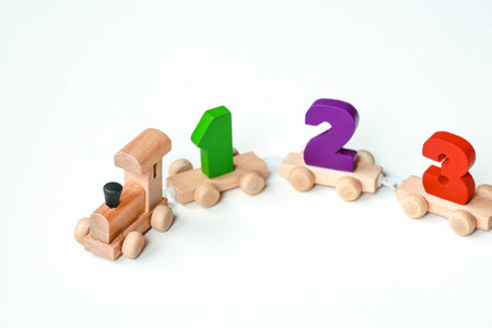 Wooden train with numbers on a white isolated background. Children's educational logic toys are used...