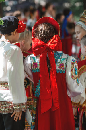 Russian folk traditions. Folk festivals. Children in beautiful Russian traditional outfits sing songs, dance and lead a round dance in Tsaritsyno Park. National Russian clothes. Sundresses and kokoshniks.のeditorial素材