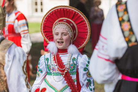 Russian folk traditions. Folk festivals. Children in beautiful Russian traditional outfits sing...