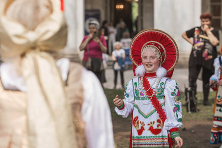 Russian folk traditions. Folk festivals. Children in beautiful Russian traditional outfits sing...
