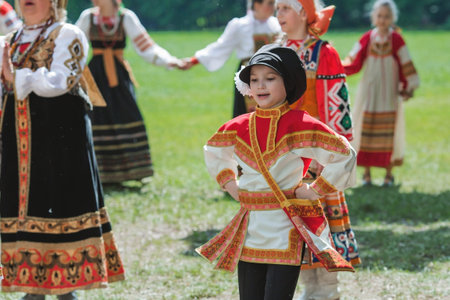 Russian folk traditions. folk festivals. Children in beautiful Russian traditional outfits sing...